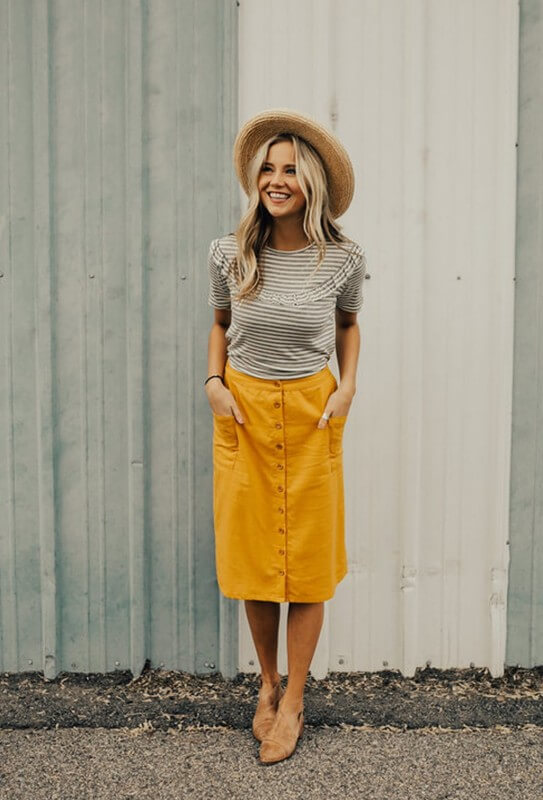 A saia midi com botões na frente é uma peça atemporal que não pode faltar no seu guarda-roupa - 2. A saia midi com botões na frente é uma peça atemporal que não pode faltar no seu guarda-roupa - Foto: Sra. Vaidade